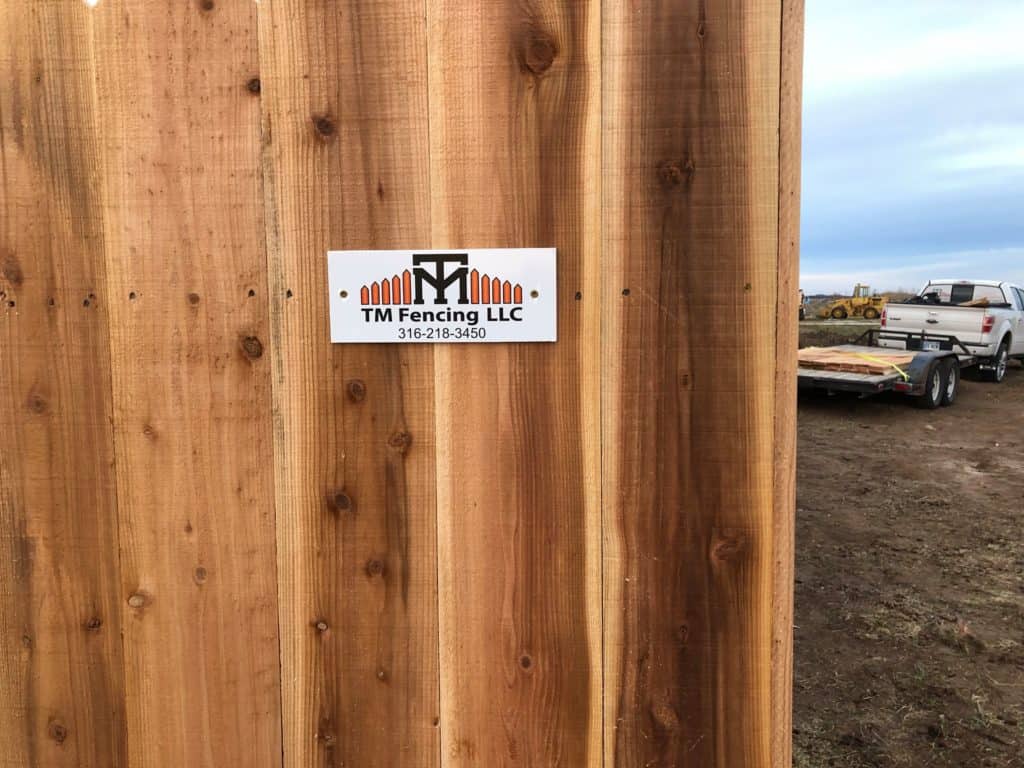 wood fence tm fencing logo
